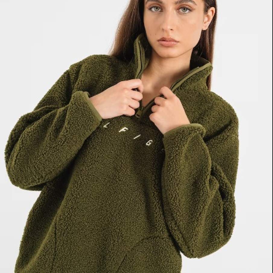 Bluză comodă în nuanță de verde militar de la Tommy Hilfiger, cu logo alb inscripționat pe materialul fleece 