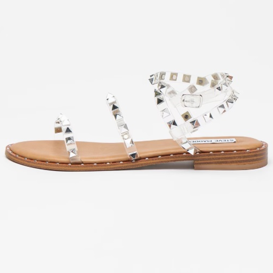 Sandale Steve Madden transparente, cu talpă joasă, decorate cu ținte argintii de efect 